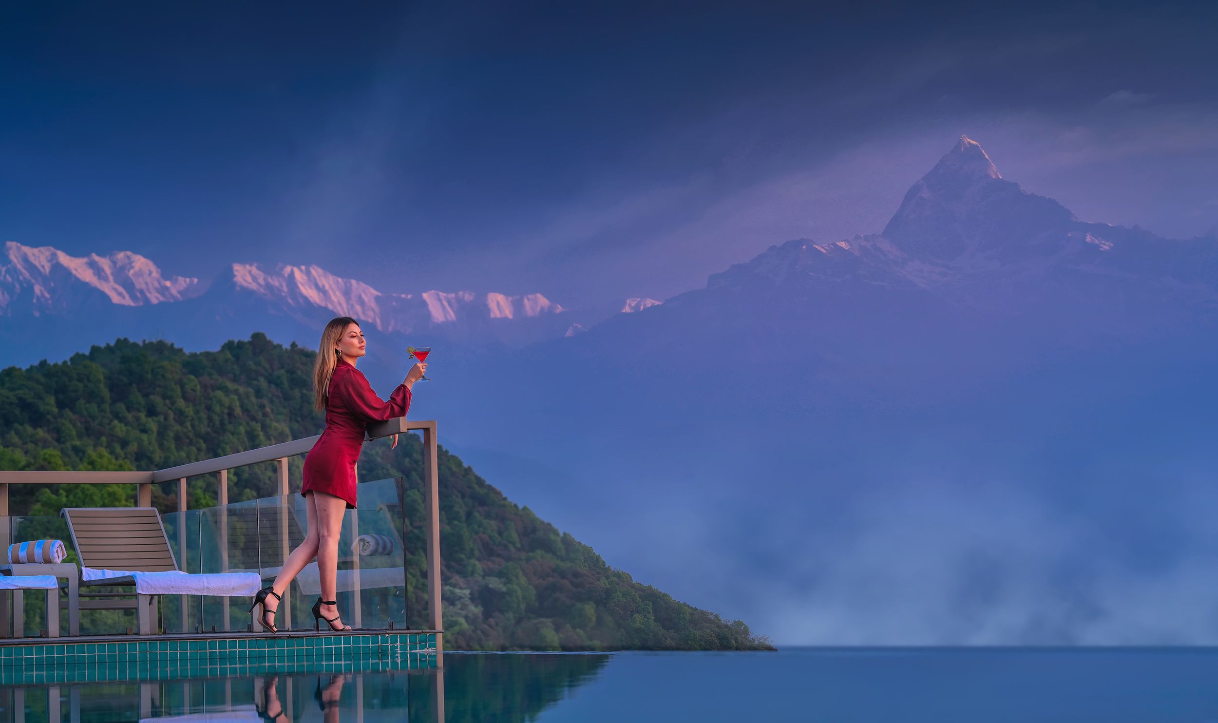 Woman enjoying view from poolside at Sarangkot. Things to do in Sarangkot