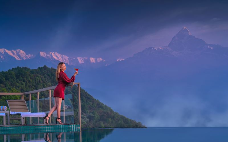 Woman enjoying view from poolside at Sarangkot. Things to do in Sarangkot